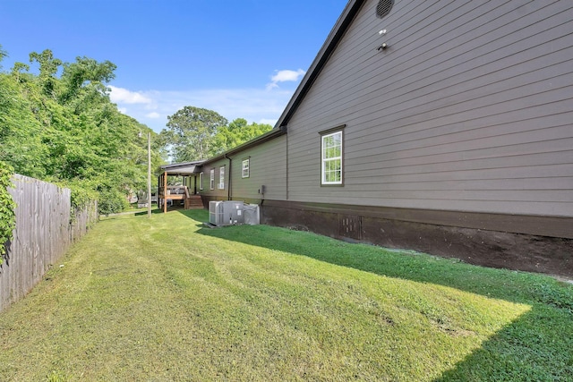 view of yard with cooling unit and a fenced backyard