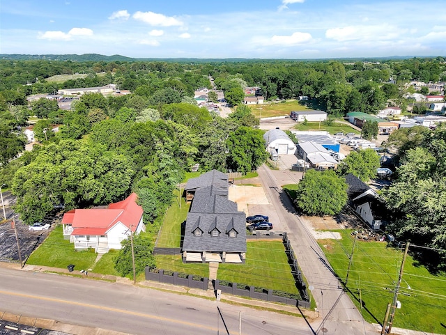 birds eye view of property with a wooded view