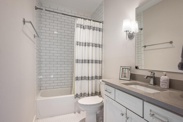 506B 36th Ave N, Nashville, TN 37209 - bathroom with toilet, shower / bath combo with shower curtain, vanity, and tile patterned flooring