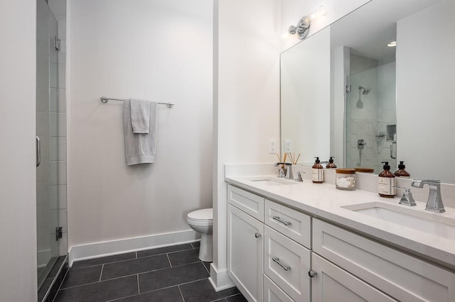 506B 36th Ave N, Nashville, TN 37209 - bathroom with a shower stall, tile patterned flooring, toilet, double vanity, and baseboards