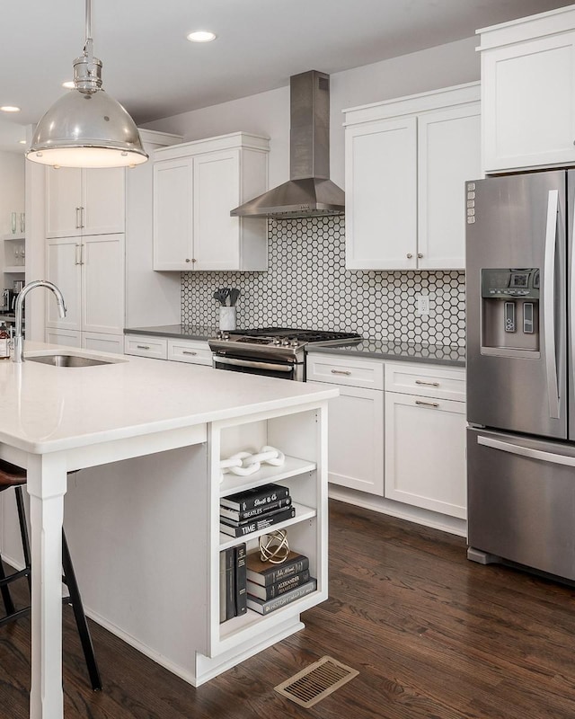 506B 36th Ave N, Nashville, TN 37209 - kitchen featuring stainless steel appliances, wall chimney exhaust hood, a sink, backsplash, and open shelves