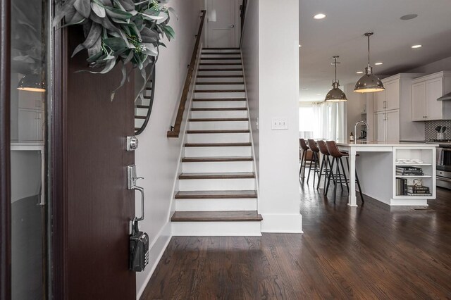 506B 36th Ave N, Nashville, TN 37209 - staircase featuring baseboards, wood finished floors, and recessed lighting