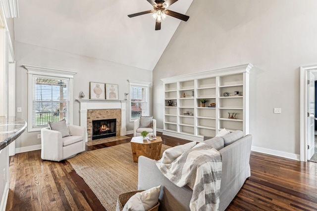 living area with dark wood-type flooring, plenty of natural light, and high vaulted ceiling