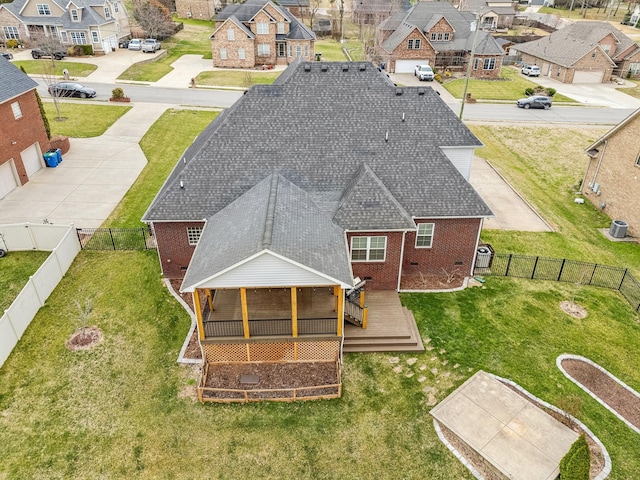 birds eye view of property with a residential view