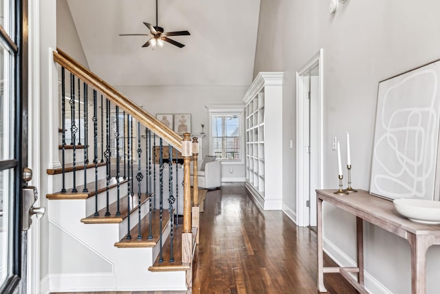 foyer entrance featuring lofted ceiling, a ceiling fan, and wood finished floors