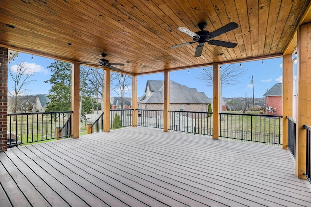 wooden terrace featuring a ceiling fan