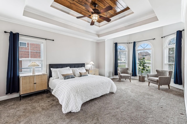 bedroom with carpet, baseboards, wood ceiling, crown molding, and a raised ceiling