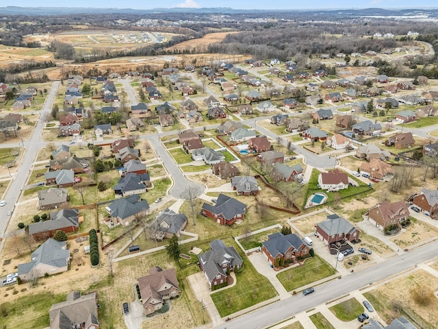 birds eye view of property with a residential view