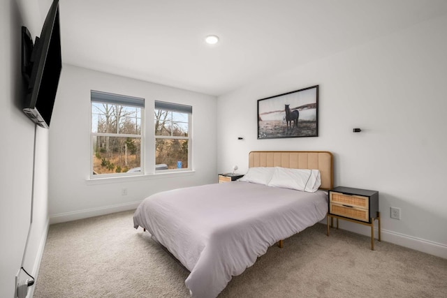 bedroom with carpet and baseboards