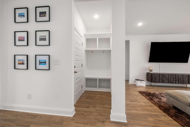 interior space featuring recessed lighting, wood finished floors, and baseboards