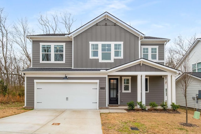 view of front of property with a shingled roof, covered porch, board and batten siding, concrete driveway, and an attached garage