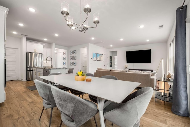 dining space featuring visible vents, recessed lighting, and light wood-type flooring