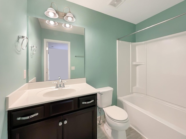 full bathroom with visible vents, toilet, vanity, and shower / bathing tub combination