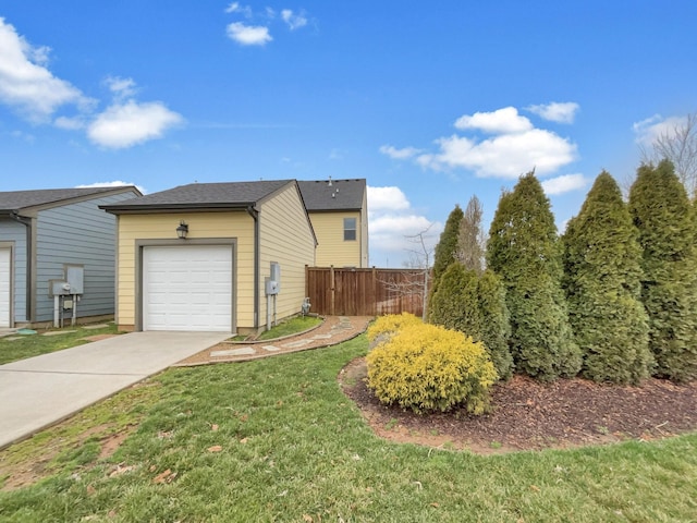 view of property exterior with a lawn, concrete driveway, and fence