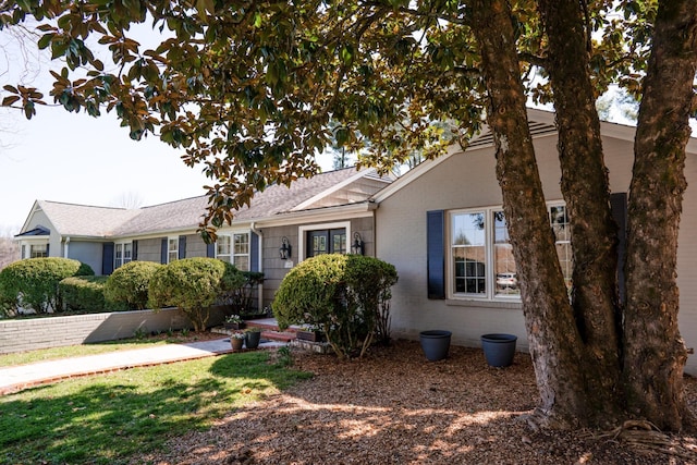 view of front of house featuring brick siding