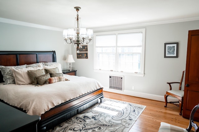 bedroom featuring hardwood / wood-style floors, heating unit, baseboards, an inviting chandelier, and ornamental molding