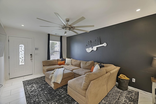 living area featuring recessed lighting, baseboards, and a ceiling fan