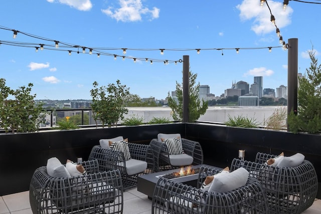 view of patio with an outdoor living space and a city view