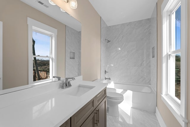 bathroom featuring visible vents, toilet, marble finish floor, shower / bath combination, and vanity