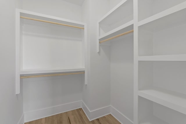 spacious closet with wood finished floors