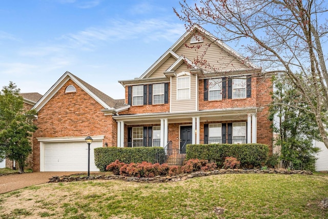 view of front of home featuring driveway, covered porch, a front yard, a garage, and brick siding