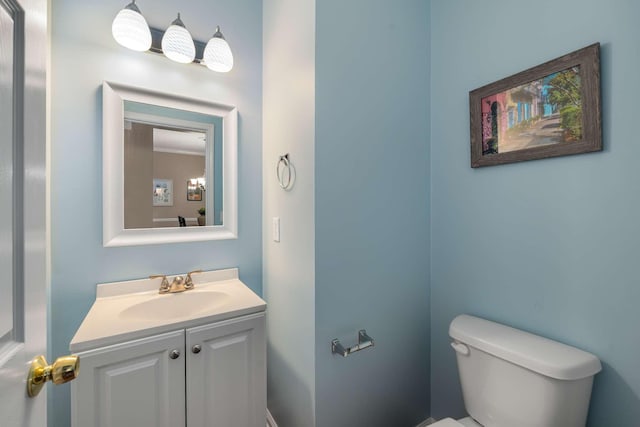 bathroom with toilet and vanity