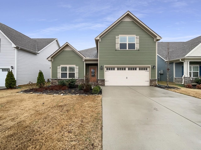 view of front of house with concrete driveway, a garage, stone siding, and roof with shingles