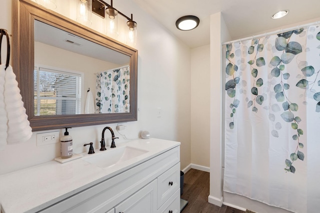 753 Theta Pike, Columbia, TN 38401 - bathroom featuring visible vents, curtained shower, wood finished floors, baseboards, and vanity