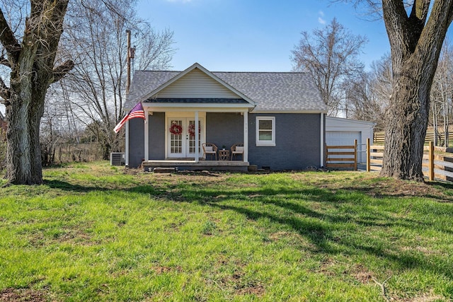 bungalow-style house featuring fence, a shingled roof, a front lawn, french doors, and brick siding