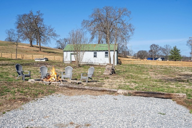 753 Theta Pike, Columbia, TN 38401 - view of front of home with a rural view, an outbuilding, fence, and an outdoor fire pit