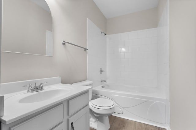 full bathroom featuring bathtub / shower combination, vanity, toilet, and wood finished floors