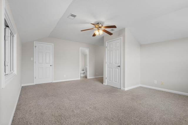 bonus room with visible vents, carpet flooring, baseboards, and vaulted ceiling