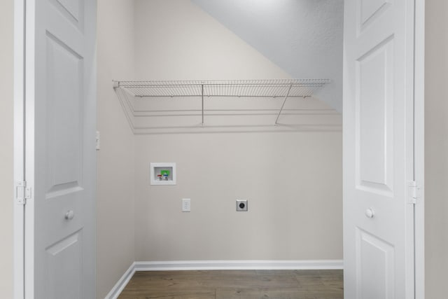 clothes washing area featuring baseboards, hookup for an electric dryer, dark wood finished floors, laundry area, and washer hookup