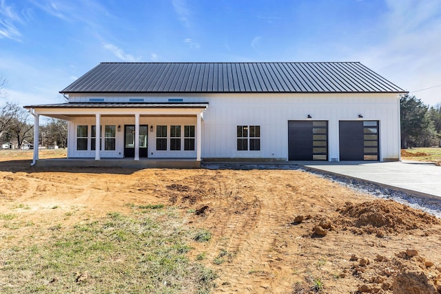 rear view of house with metal roof