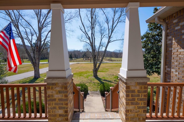 view of yard featuring covered porch