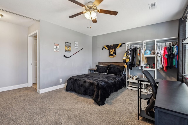 carpeted bedroom featuring visible vents, baseboards, and ceiling fan