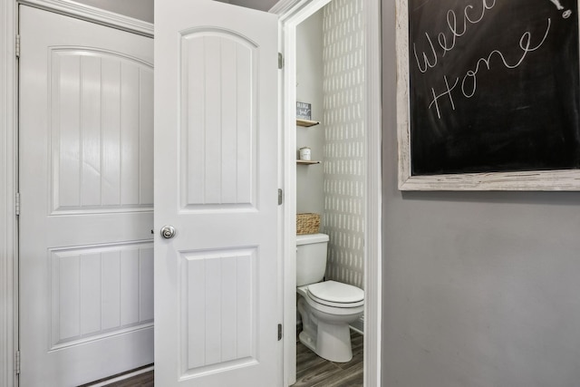 bathroom featuring toilet and wood finished floors