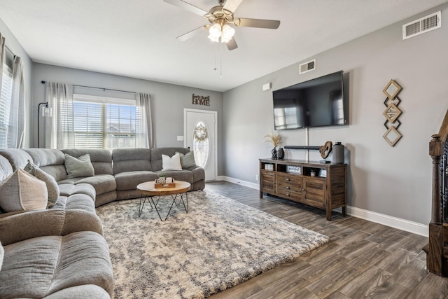 living area with a ceiling fan, baseboards, visible vents, and dark wood-style flooring