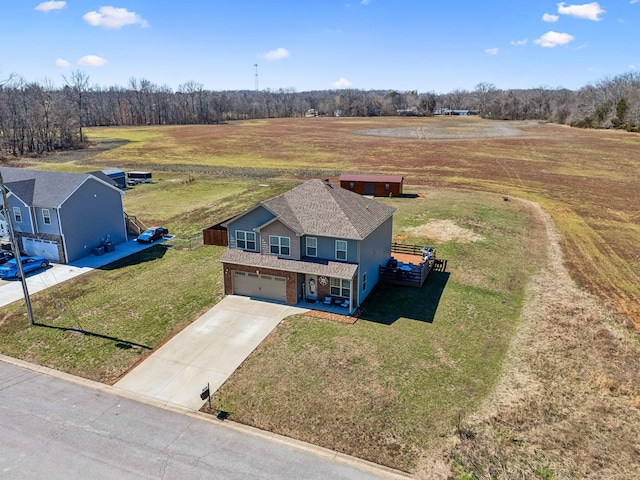 birds eye view of property with a rural view