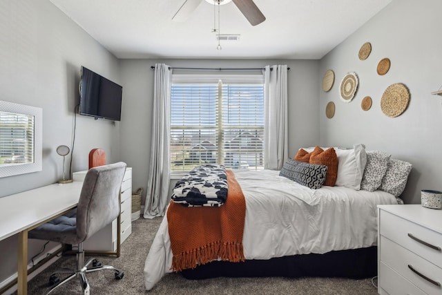 carpeted bedroom featuring visible vents and ceiling fan