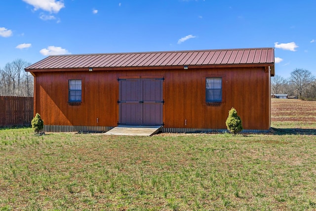 view of shed with fence