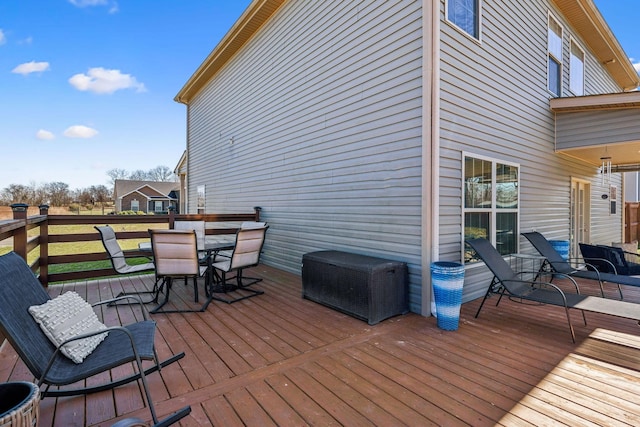 wooden terrace featuring outdoor dining area