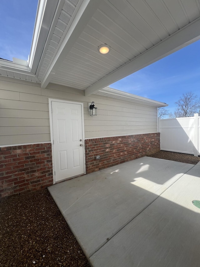 view of patio / terrace featuring fence