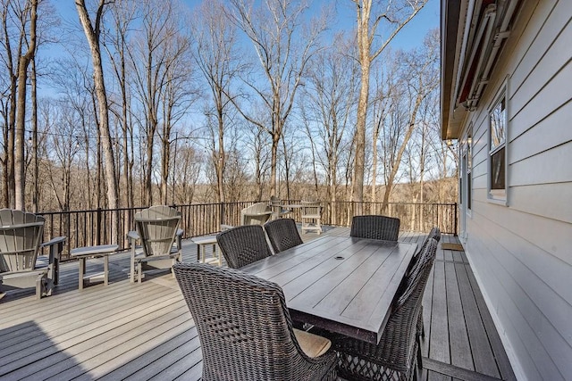 wooden terrace with outdoor dining area