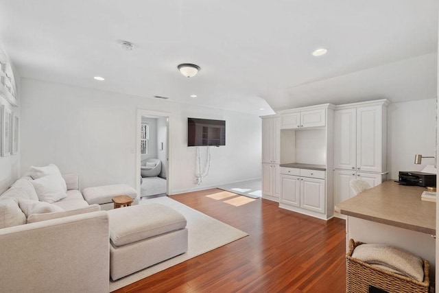 living area with recessed lighting and dark wood-style floors