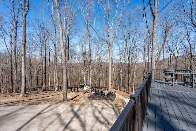 wooden terrace with a forest view