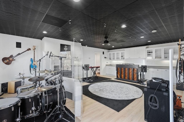 interior space featuring wood finished floors and ceiling fan