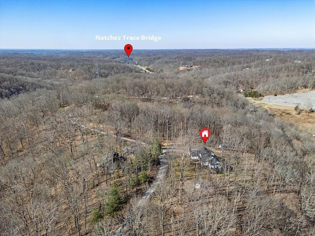 bird's eye view featuring a forest view