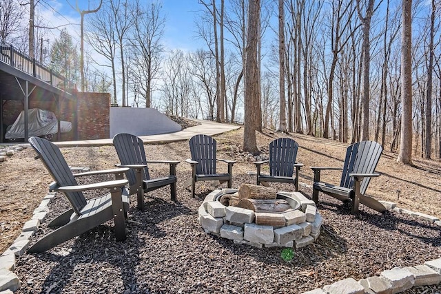 view of yard with an outdoor fire pit