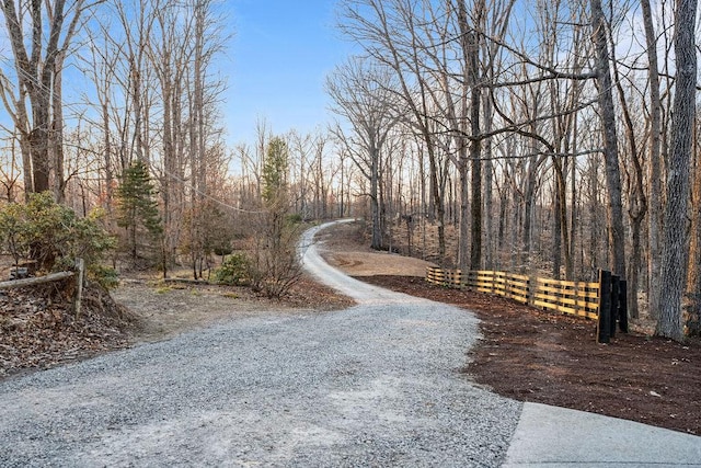 view of street featuring a forest view